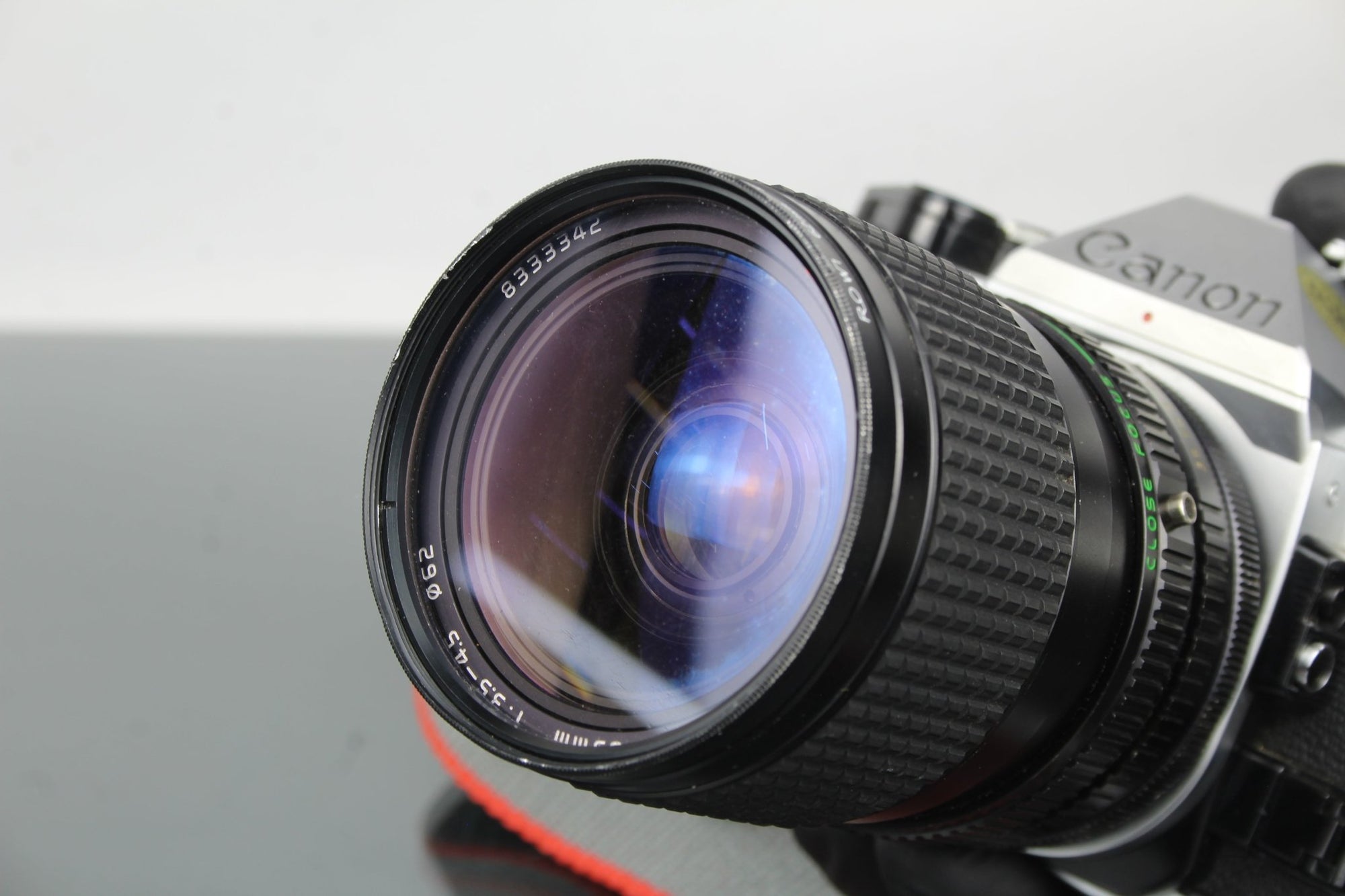 Canon AE - 1 Program + Tokina AT - X 28 - 85mm Canon FD mount lens - Dutch|Thrift